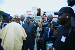 Tinubu flanked by Saint Lucian at the airport